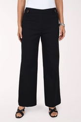 Front view of the Zac and Rachel Buckle Waist Wide Leg Pant in black, showing the buttoned buckle waistband and full-length wide leg with black sandals