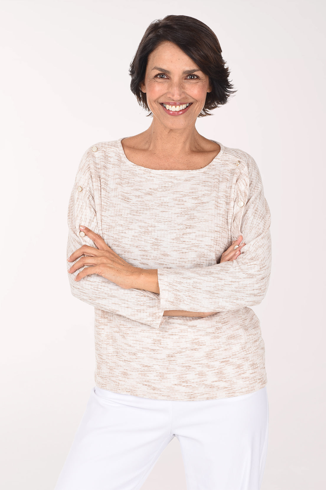 Woman wearing a beige long sleeve sweater