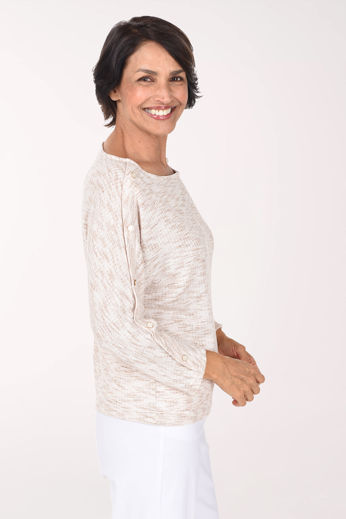 Woman wearing a beige long sleeve sweater