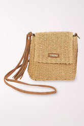 Woven crossbody with a tan tassel