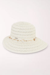 White woven hat with a shell detail