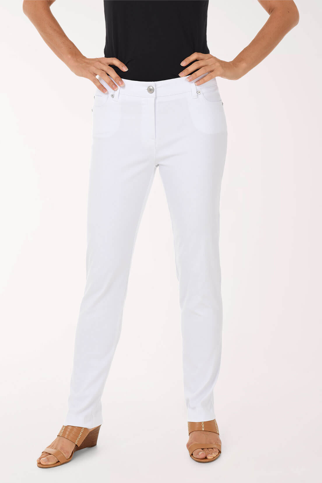 Person wearing white pants on a plain background